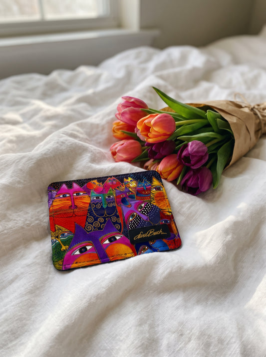 Monarque Laurel Burch Fantasticats slim wallet card holder on white bedding with tulips
