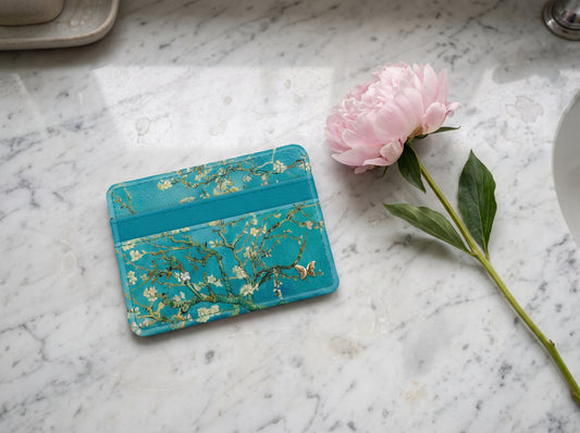 Monarque Van Gogh Almond Blossom slim wallet card holder on marble with peony