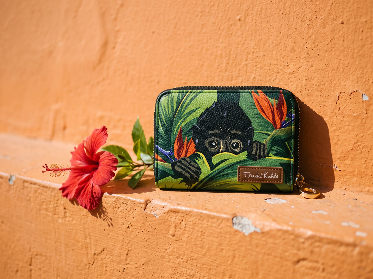 Frida Kahlo Monkey RFID zipper wallet on an orange wall with a red hibiscus flower